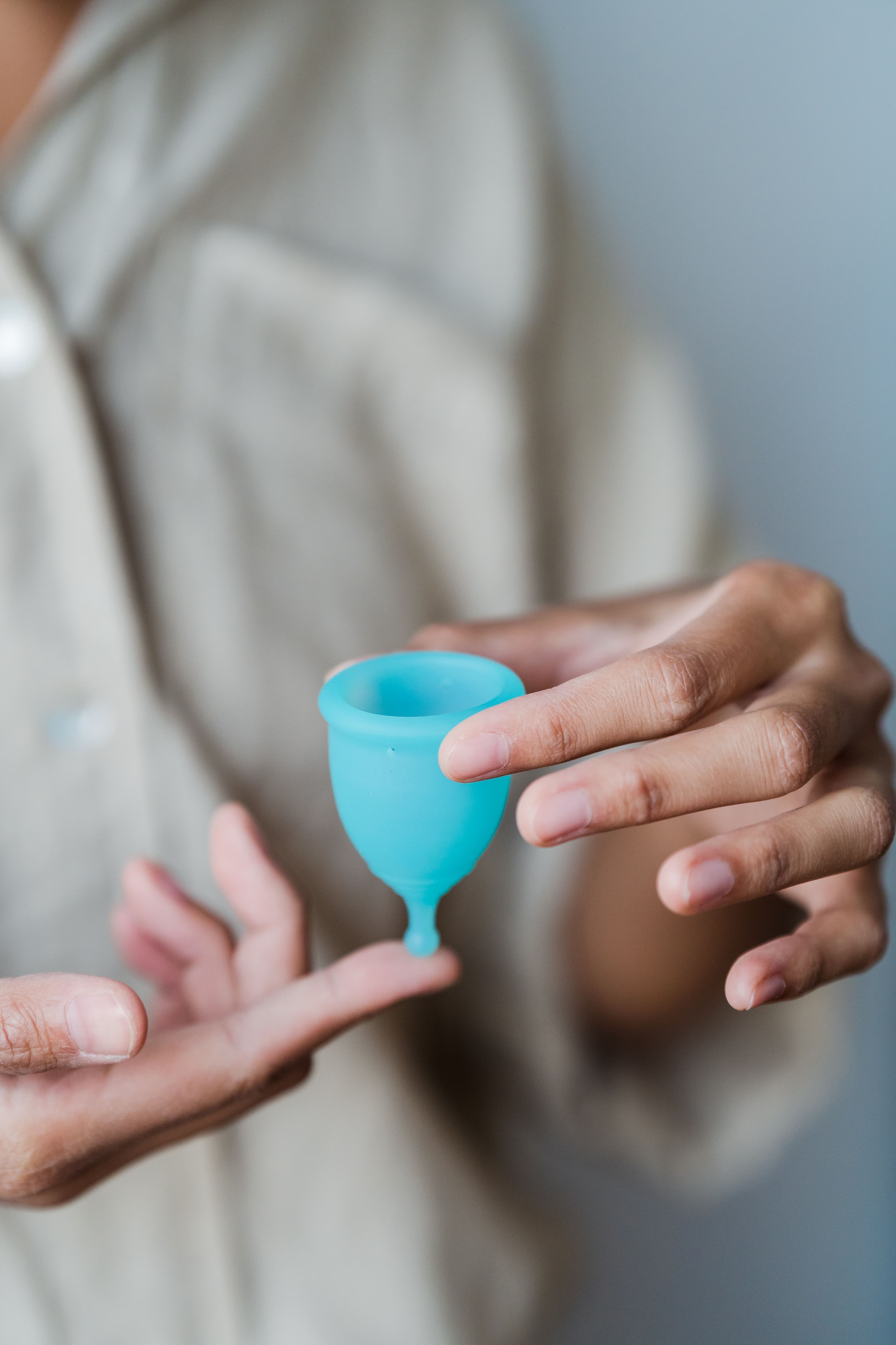 Holding a menstrual cup